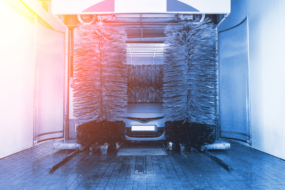 Car moving through an automatic express tunnel car wash